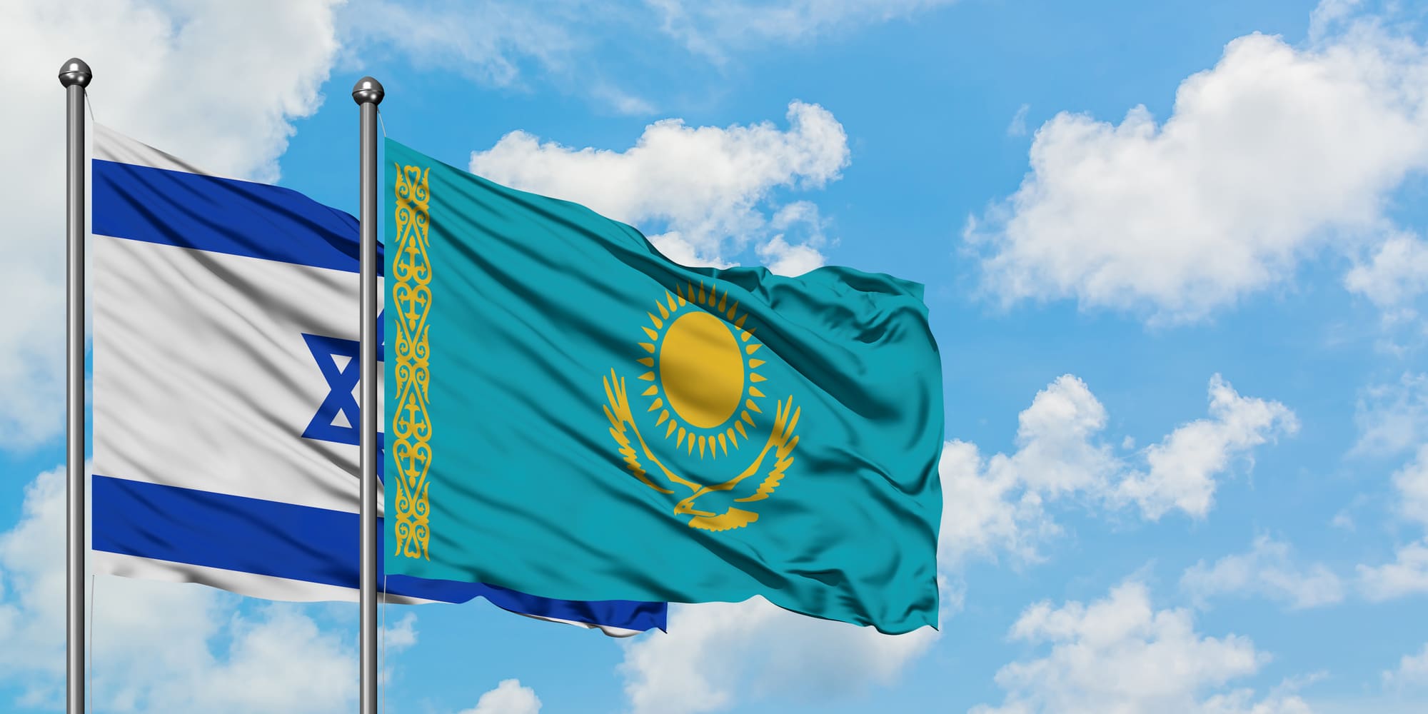 israel and kazakhstan flag waving in the wind against white cloudy blue sky together. diplomacy concept, international relations. israel and kazakhstan flag waving in the wind against white cloudy blue sky together. diplomacy concept, international relations.