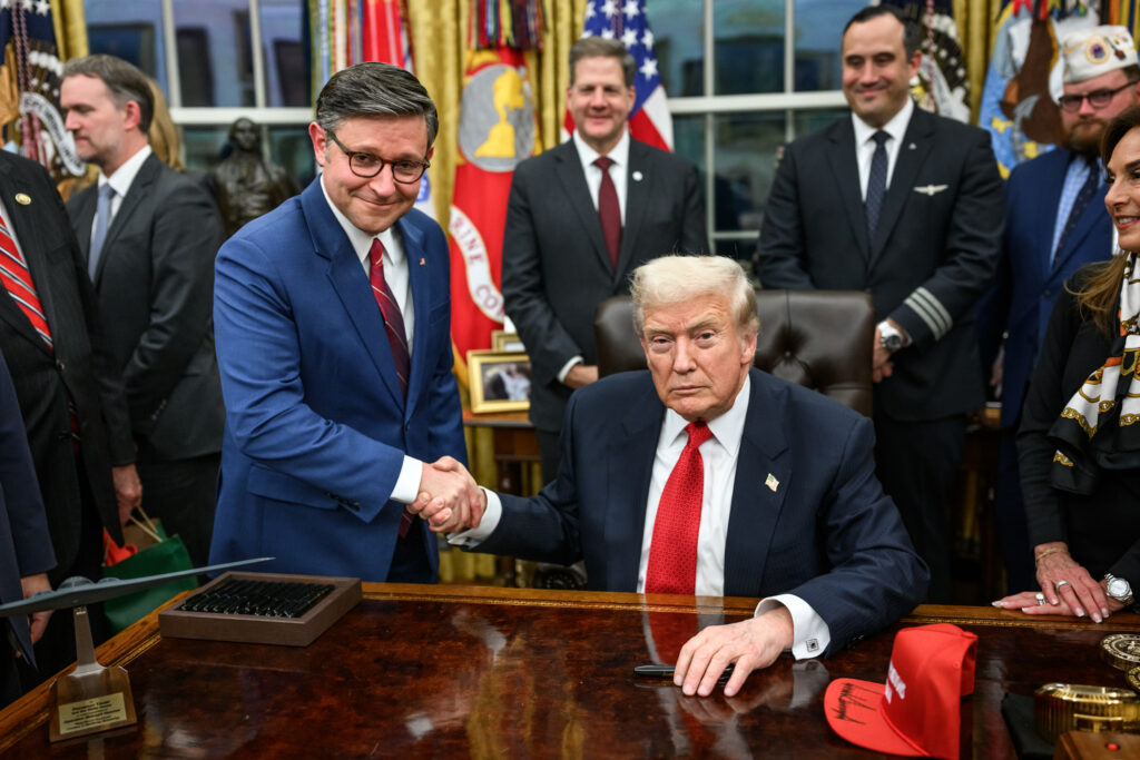 president donald trump and speaker of the house mike johnson shake hands after signing the funding bill that reopens the government (54921432079)