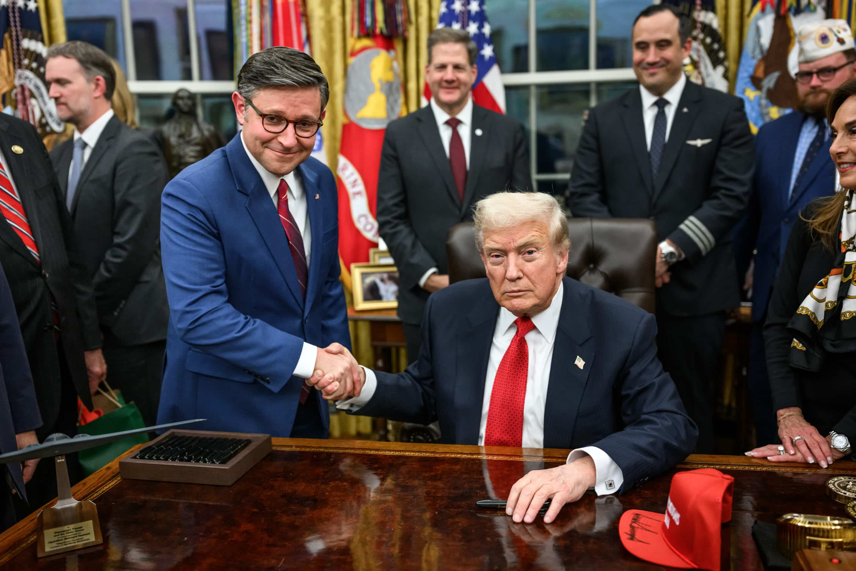 president donald trump and speaker of the house mike johnson shake hands after signing the funding bill that reopens the government (54921432079)